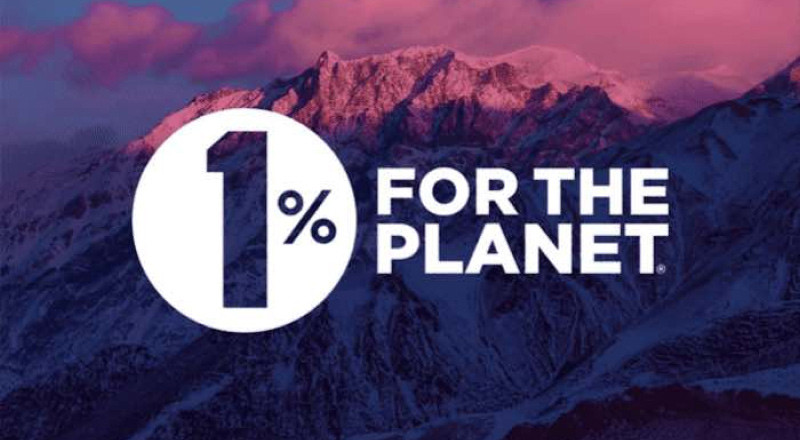 Mountains during a sunset with the logo 1% For The Planet overtop.