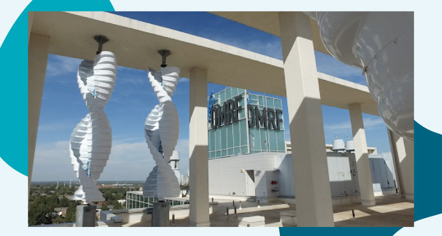 OMRF promotional image depicting a building with double-helix columns.