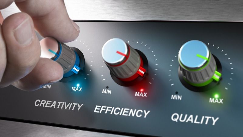 A symbolic image signifying the maximization of creativity, efficiency and quality by showing a technical control unit with three labeled knobs turned to maximum.