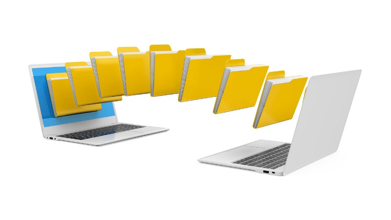 Image of files being transferred between two laptops.